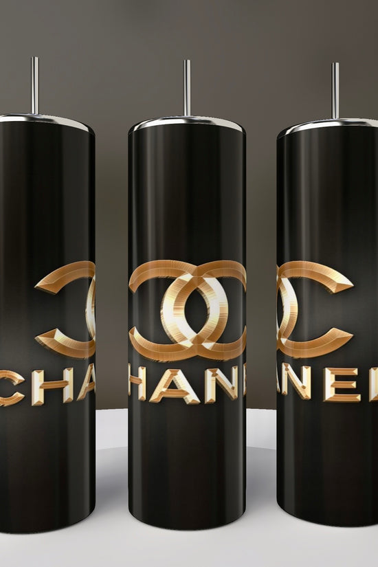 Three tall, black Chanel 20oz Skinny Tumblers by Kreative Kreationz, each with a metallic straw, gold-tone logo, and bold 