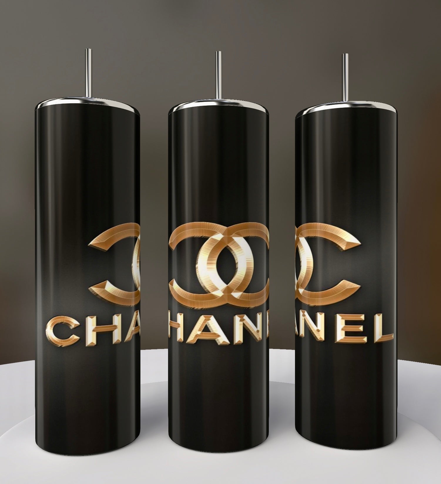 Three tall, black Chanel 20oz Skinny Tumblers by Kreative Kreationz, each with a metallic straw, gold-tone logo, and bold "CHANEL" lettering—perfect luxury drinkware for any collection.