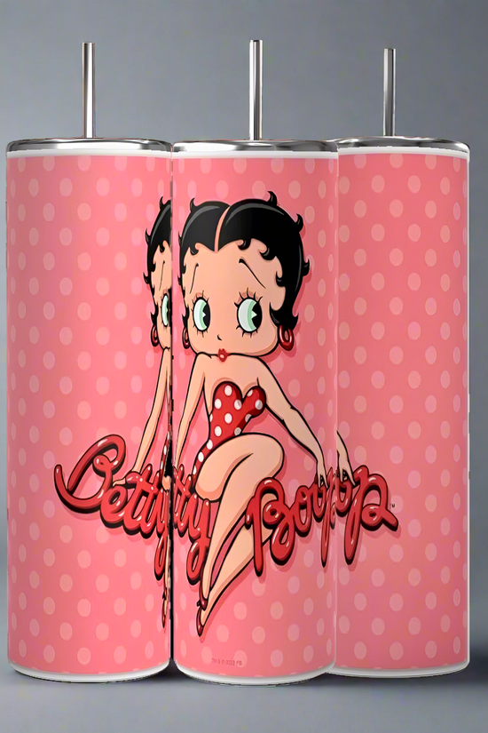The Kreative Kreationz Betty B 20oz Skinny Tumblers come in sets of three pink designs with red polka dots, showcasing Betty Boop in a matching outfit. Their durable build ensures long-lasting enjoyment, making them an ideal sublimated tumbler for every fan.