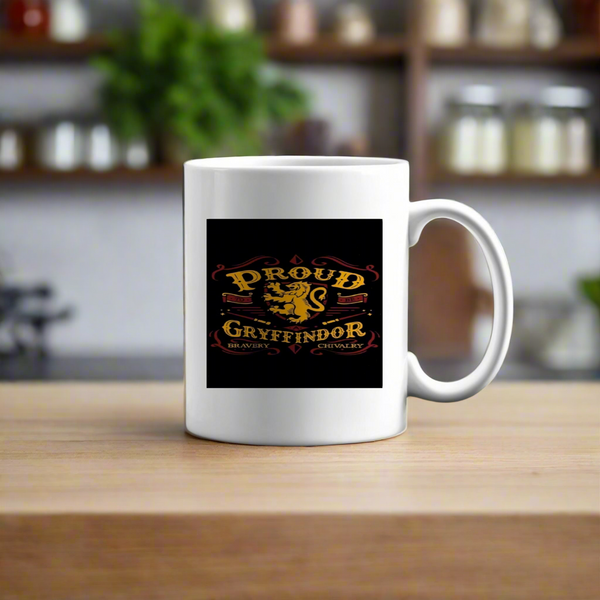 The Kreative Kreationz Proud Gryffindor Ceramic Mug (11 oz) features "Proud Gryffindor Bravery Chivalry" in gold and red with a lion emblem, vibrant design, and is shown on a wooden surface with a blurred kitchen in the background.