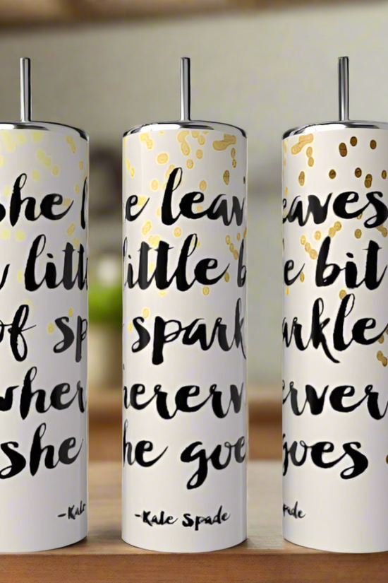 Three tall, decorative white candles feature a bold black quote: 