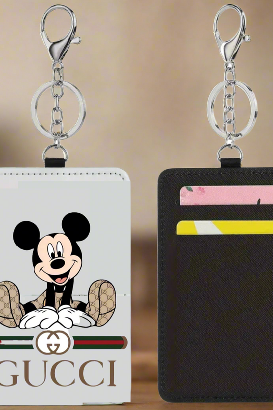 Two Kreative Kreationz Mickey Gucci Card Wallets are shown: one slim wallet features Mickey Mouse and a Gucci logo, while the other displays card slots with two cards. Both minimalist wallets include metal key rings at the top.