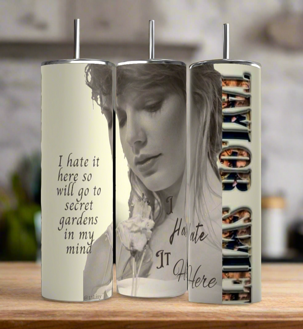 Three Kreative Kreationz Secret Garden Taylor Swift 20oz stainless steel tumblers with metal straws feature black-and-white art, floral designs, the quote "I hate it here so will go to secret gardens in my mind," and spill-proof lids.