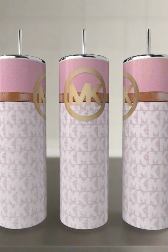 Three MK Pink Buckle 20oz Tumblers by Kreative Kreationz, in pink and white with metallic lids and straws, sit on a kitchen counter. Each stainless steel tumbler features a repeating 