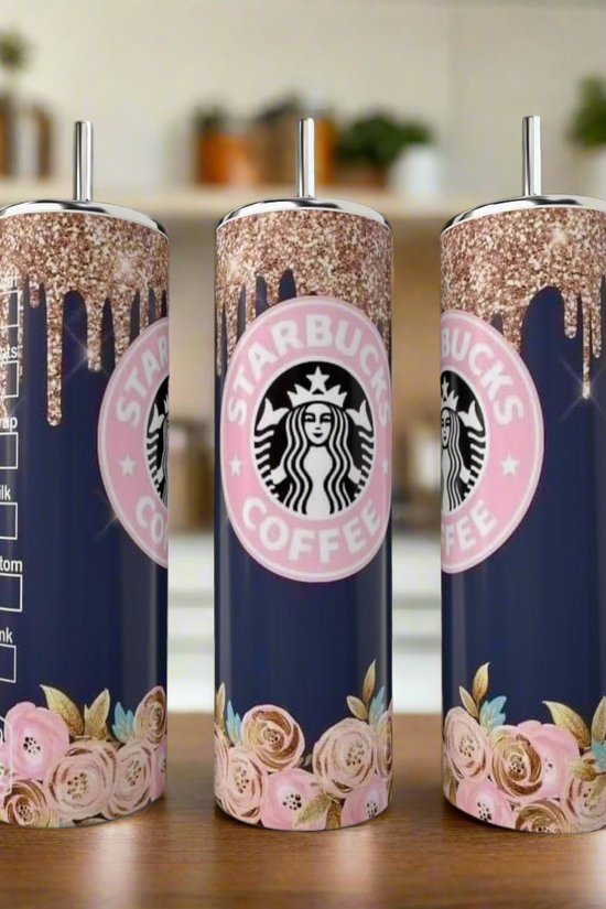 Kreative Kreationz’s Starbucks Floral Drip 20oz skinny tumblers feature navy bases, pink and gold glitter drips, pink roses, metallic straws, and the Starbucks Coffee logo. Three are shown on a kitchen counter.