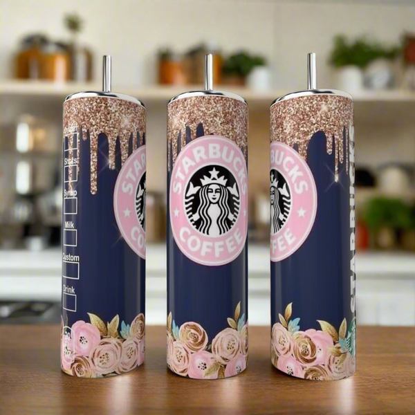 Kreative Kreationz’s Starbucks Floral Drip 20oz skinny tumblers feature navy bases, pink and gold glitter drips, pink roses, metallic straws, and the Starbucks Coffee logo. Three are shown on a kitchen counter.