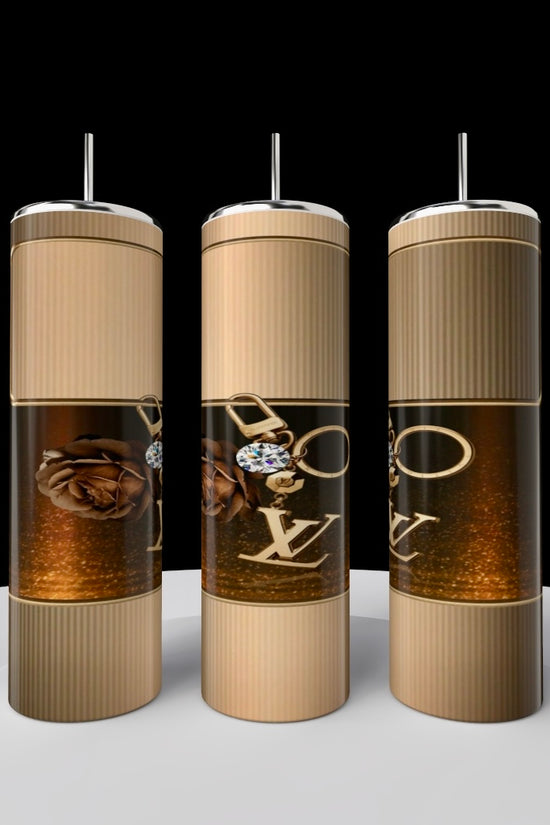 Three luxurious MK Chrome Cursive 20oz Tumblers by Kreative Kreationz glisten against a black background. Each tumbler features elegant gold designs and reflects an eco-friendly touch of elegance with prominent 