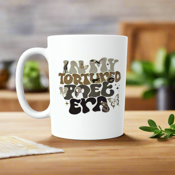 The Kreative Kreationz IN MY TTPD ERA Ceramic Mug features a wavy-font design with butterflies and birds—an ideal gift for any Swiftie or Taylor Swift fan. Perfect as a coffee mug or tea cup from the TTPD collection!.