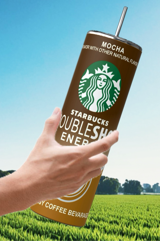 Amidst the vibrant greenery and under a clear blue sky, a hand grasps an oversized Kreative Kreationz Energy Shot 20oz Tumbler, highlighting its impressive capacity.