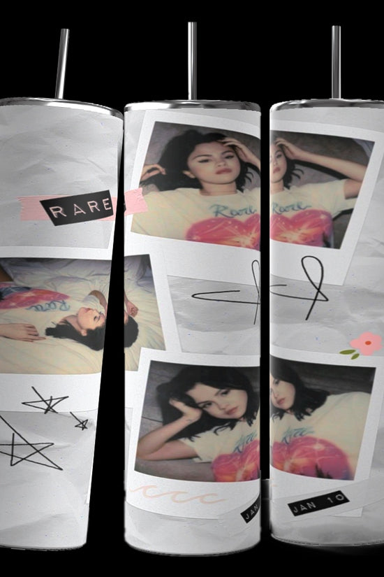 Three tall tumblers are decorated with images of Selena Gomez in different poses; one in a white dress, one with a serious expression, and one in casual attire. The designs, reminiscent of intricate Stanley cups, are embellished with flowers, leaves, hearts, and text like 