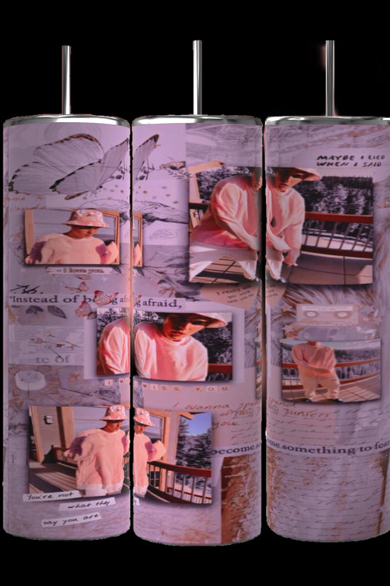 Three cylindrical pillars exhibit a collage of pink and white-themed photos and handwritten text, featuring images of a person in a pink hoodie and hat, posing in various outdoor settings. Butterflies and abstract designs create the backdrop, evoking the style of the Justin Bieber 20oz Tumbler from Kreative Kreationz.