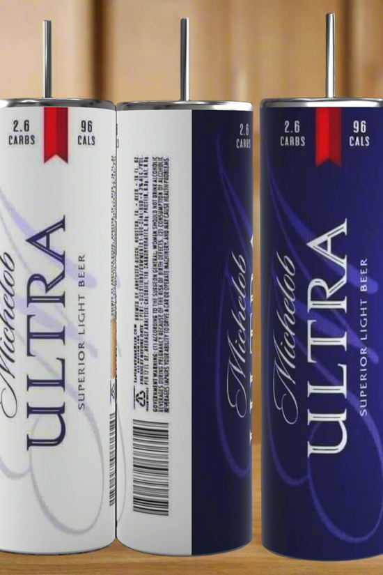 Three Michelob ULTRA light beer cans sit on a kitchen counter, showing front, side, and back views. Pair your beer with the Kreative Kreationz Michelob Ultra 20oz Stainless Steel Tumbler for the perfect sip.