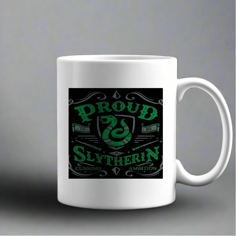 The Kreative Kreationz Proud Slytherin Ceramic Mug is a white mug with a green and black snake design and the text "Proud to be Slytherin, Cunning, Ambition.