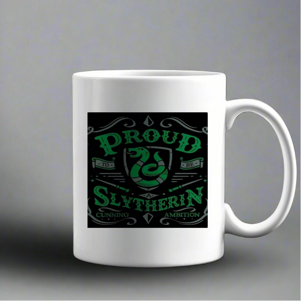 The Kreative Kreationz Proud Slytherin Ceramic Mug is a white mug with a green and black snake design and the text "Proud to be Slytherin, Cunning, Ambition.
