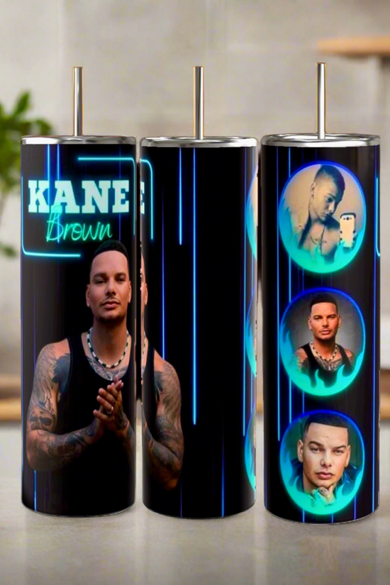 Three Kreative Kreationz Kane Brown 20oz Tumblers, featuring a full-body image and circular portraits of the singer on a black and neon blue background, are displayed on a kitchen counter.