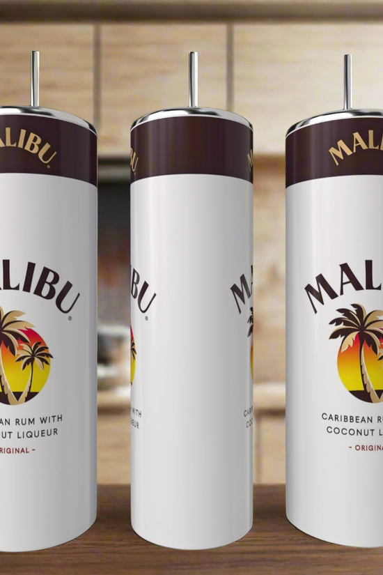Three white Kreative Kreationz Malibu 20oz Tumblers with metal straws sit on a kitchen counter, each eco-friendly cup displaying the Malibu logo with palm trees and the text: 