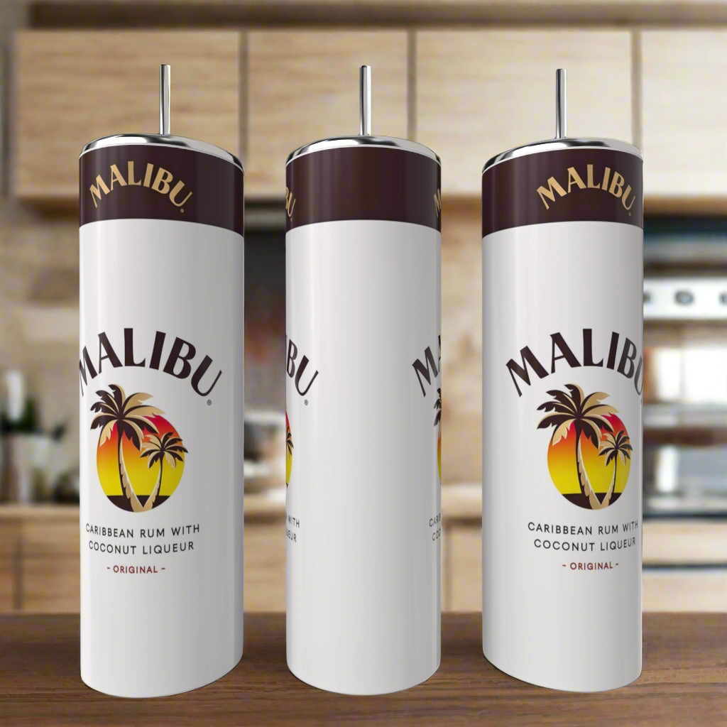Three white Kreative Kreationz Malibu 20oz Tumblers with metal straws sit on a kitchen counter, each eco-friendly cup displaying the Malibu logo with palm trees and the text: "Caribbean Rum With Coconut Liqueur.