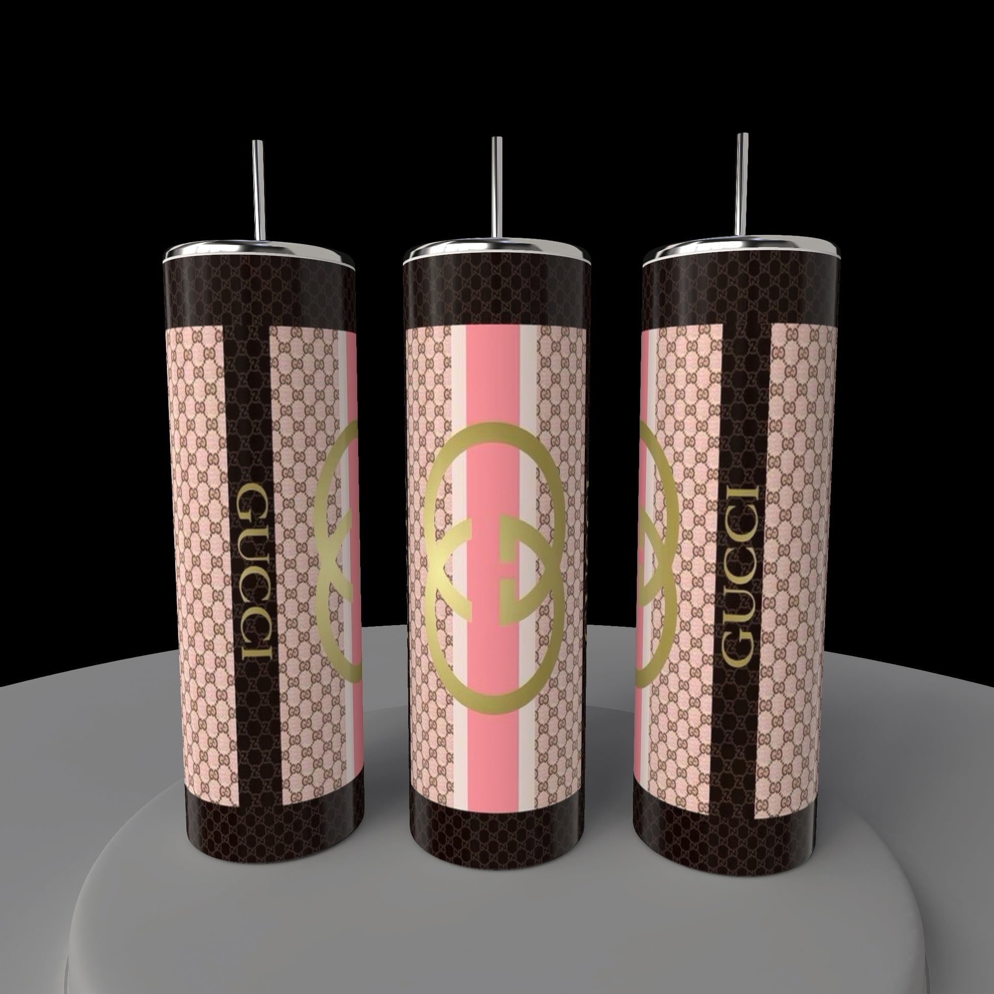 Three Gucci Brown 20oz Skinny Tumblers, branded by Kreative Kreationz, showcase a geometric pattern. The two outer tumblers feature a brown and pink design with "Gucci" branding, while the central one has overlapping circular motifs. A true embodiment of luxury drinkware.