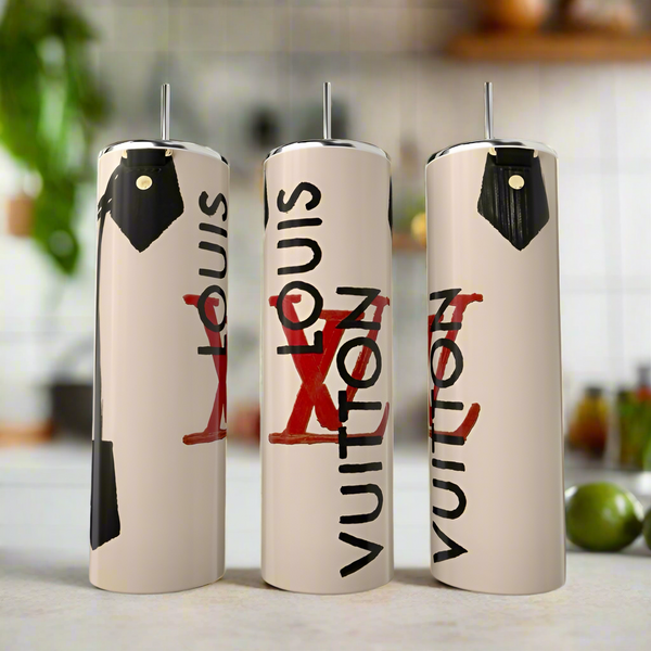 Three 20oz stainless steel tumblers by Kreative Kreationz showcase a Louis Vuitton tan purse design with stylish black lettering and red accents, arranged on a kitchen counter with a blurred background.
