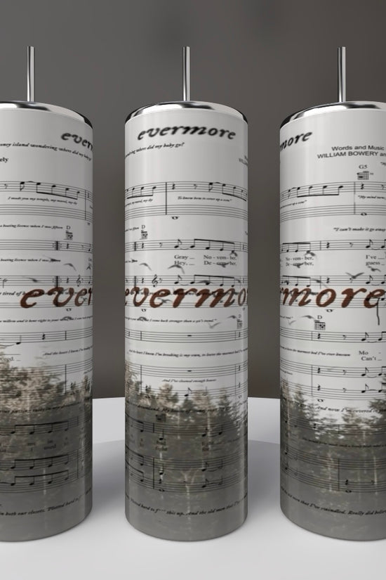 Three tall cylindrical sculptures resembling Kreative Kreationz's Taylor Swift Evermore 20oz Skinny Tumbler exhibit musical notes and 