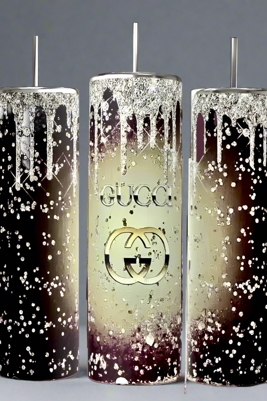 Three tall Kreative Kreationz candles, designed in a dark brown to cream gradient with metallic drips and speckles, echo luxury. The center candle features the iconic 