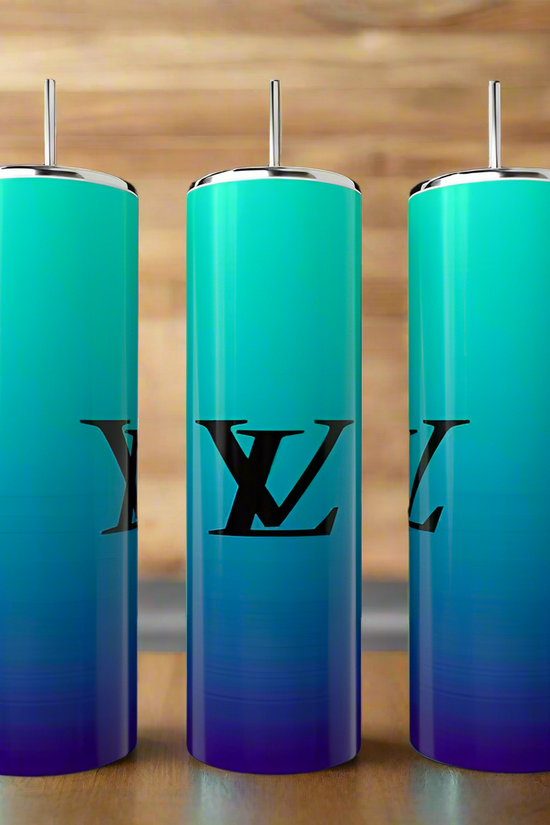 Three Ombré LV 20oz Tumblers by Kreative Kreationz in blue and green hues with metal straws rest on wood. Featuring a luxe 