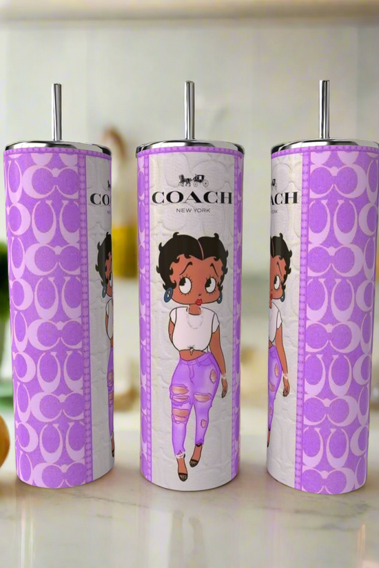 Three Boop purple 20oz Skinny Tumblers by Kreative Kreationz sit on a counter. Each features the brand logo and a cartoon girl with curly hair, white shirt, and ripped purple jeans—a playful take on a classic reusable tumbler.