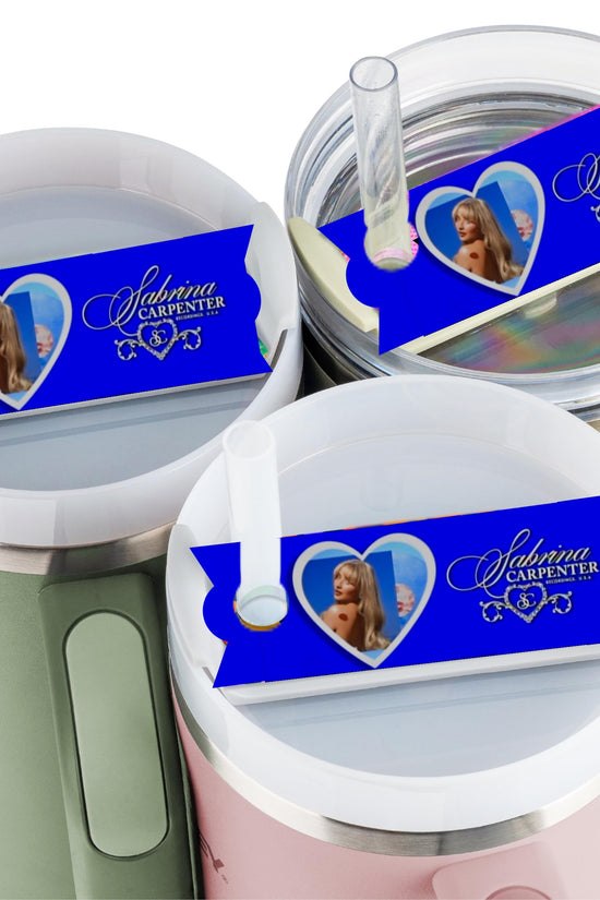 Three tumblers with lids and straws feature the Kreative Kreationz Sabrina Carpenter Stanley lid Topper, which displays a heart-shaped photo of Sabrina Carpenter, her name, and musical notes on a decorative background.