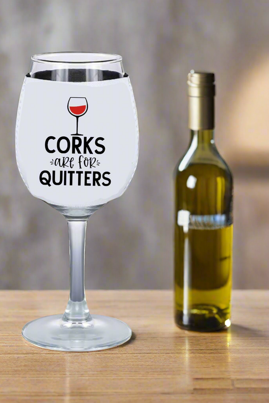 The Corks Are For Quitters - Wine Glass Koozie by Kreative Kreationz pairs perfectly with a large wine glass and bottle of white wine, making it an ideal accessory for any wine lover.