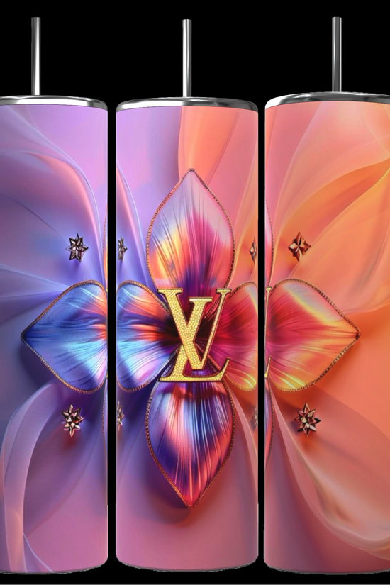Three tall, cylindrical LV Puffy 20oz Tumblers by Kreative Kreationz come complete with metal straws. The first tumbler showcases a gradient background transitioning from blue to violet, adorned with a large, colorful floral centerpiece. The middle and right tumblers feature similar floral designs, each boasting unique color gradients and durable construction for maximum longevity.