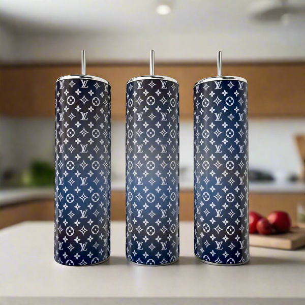 Three LV Ombre 20oz Skinny Tumblers by Kreative Kreationz sit on a kitchen counter, each with a navy and black gradient seamless design featuring white designer-style logos, and come with metal straws.