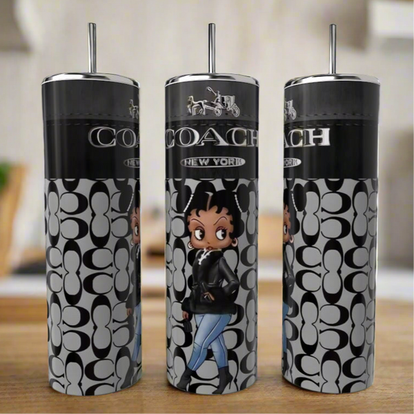 The Boop 20oz Skinny Tumbler by Kreative Kreationz is a set of three tall stainless steel tumblers with metal straws, featuring a black and gray Coach-style pattern and a cartoon woman in a black jacket and blue jeans.