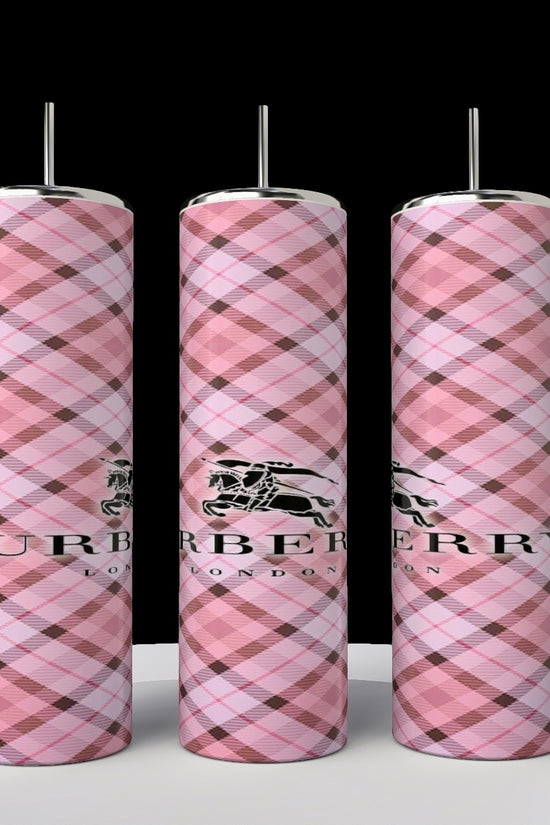 Three Burberry 20oz Skinny Tumblers by Kreative Kreationz, featuring pink plaid patterns and silver tops, display a horse and knight logo against a black background.