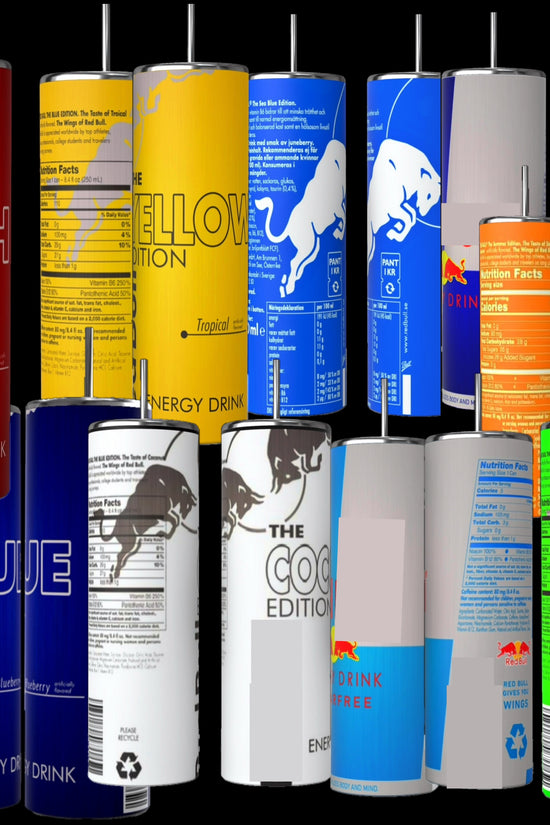 Assorted Red Bull cans in various flavors are arranged beside a Kreative Kreationz RB Lovers 20oz Tumbler from the stainless steel collection, featuring a spill-proof lid and visible branding.