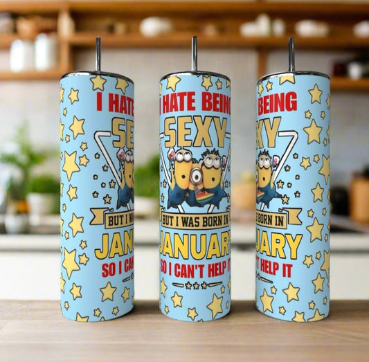 Three Minion Sexy Month 20oz Tumblers by Kreative Kreationz with cartoon designs and “I hate being sexy but I was born in January so I can't help it” text sit on a counter—fun, reusable gifts for fans.
