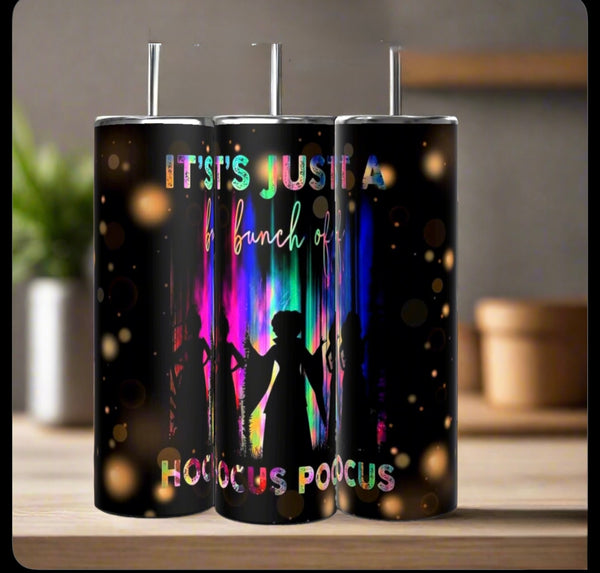 The Kreative Kreationz “It’s Just a Bunch of Hocus Pocus” 20oz tumblers feature three witches’ silhouettes, colorful lights on a black background, clear lids with straws, and the fun quote: “It’s just a bunch of Hocus Pocus.”.