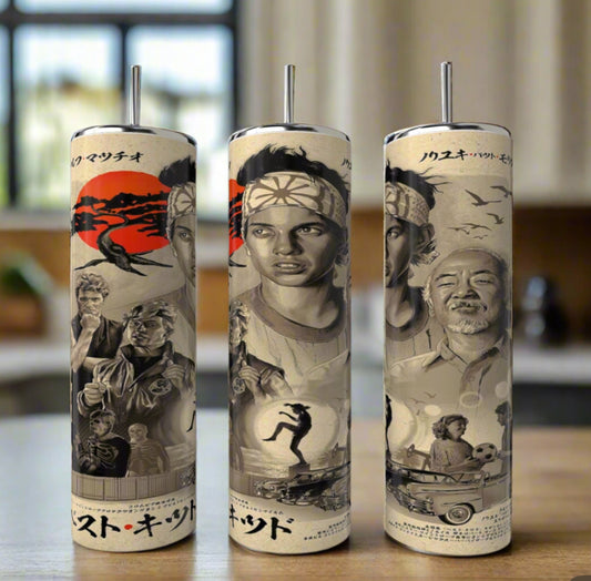The Kreative Kreationz Kobra Kai 20oz Stainless Steel Tumbler features black-and-white Karate Kid character art, including a headbanded young man, an older mentor, action scenes, Japanese text, and a red sun backdrop.