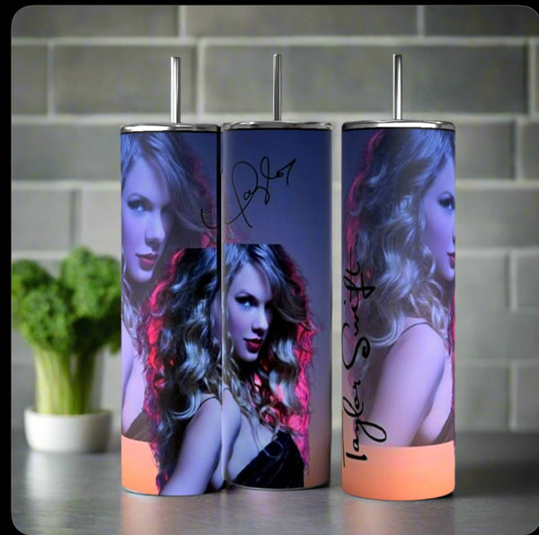 Three Kreative Kreationz Taylor Swift Aesthetic 20oz Tumblers with straws are arranged on a kitchen counter, showcasing a woman with curly blond hair and two signatures. Eco-friendly vibes: broccoli is visible against the tiled backsplash.