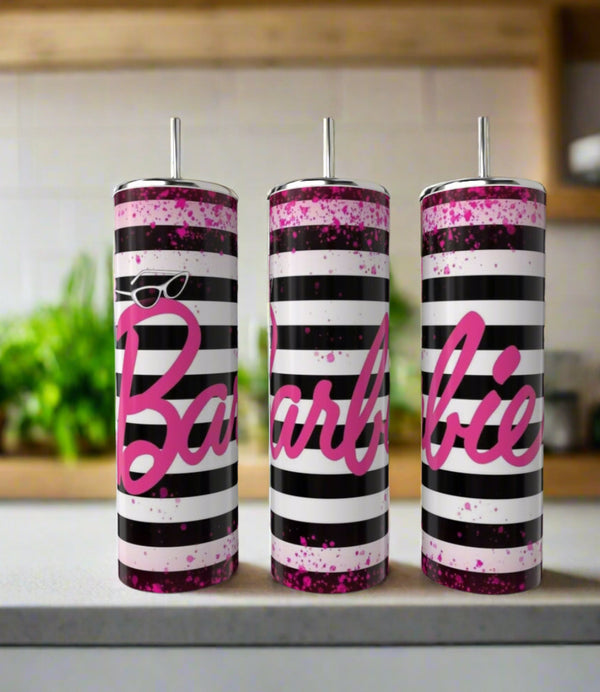 The Kreative Kreationz Barbie Stripe 20oz Tumblers come in a set of three, each with black and white stripes, pink splatters, bold pink "Barbie" script, a silver straw, and a stylish look for your kitchen counter.