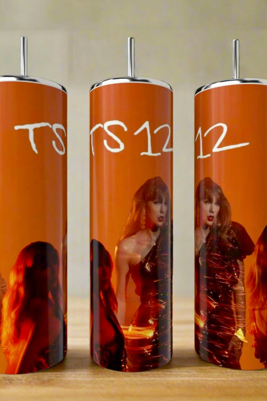 Three TS12 | Orange Taylor Swift 20oz tumblers by Kreative Kreationz, featuring a woman in a shiny dress, orange-red background, and 