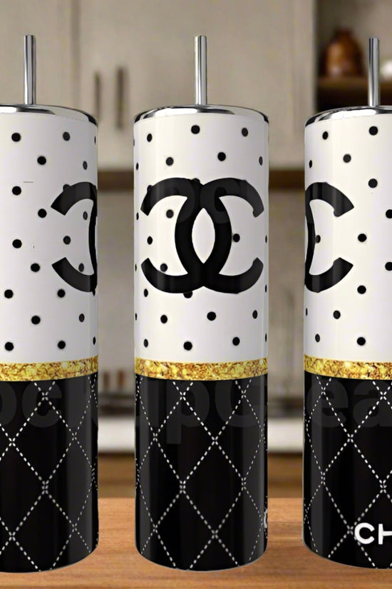 Set of three Chanel 20oz Skinny Tumblers by Kreative Kreationz, featuring black and white polka dots, a gold glitter stripe, quilted patterns, straws, and bold Chanel logos—must-have luxury drinkware for collectors.