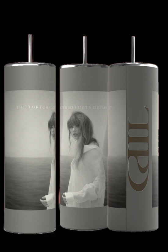 Against a black background, three TTPD grey 20oz Tumblers by Kreative Kreationz are displayed, each topped with a metallic lid. The tumblers showcase a monochromatic image of a woman in a sheer white dress standing by water, accompanied by the text 