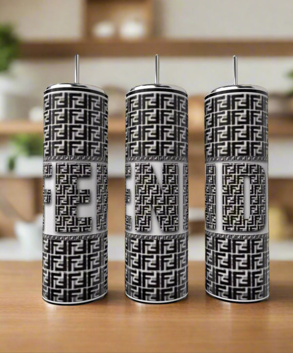The Kreative Kreationz FENDI Black 20oz Skinny Tumblers feature black-and-white geometric patterns that spell out "FENDI," making them a stylish and eco-friendly luxury drinkware choice.