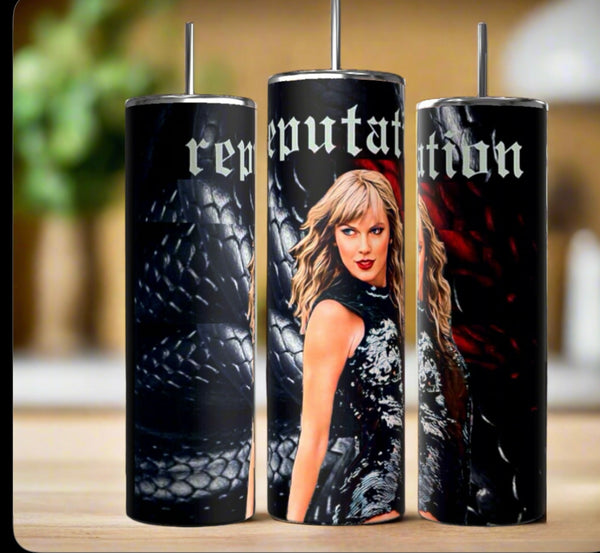The Kreative Kreationz Taylor Swift Reputation Snake 20oz Tumbler features a woman with blonde hair in black, set on a dark scaly background with "reputation" in gothic letters—a stylish, eco-friendly addition to any collection.