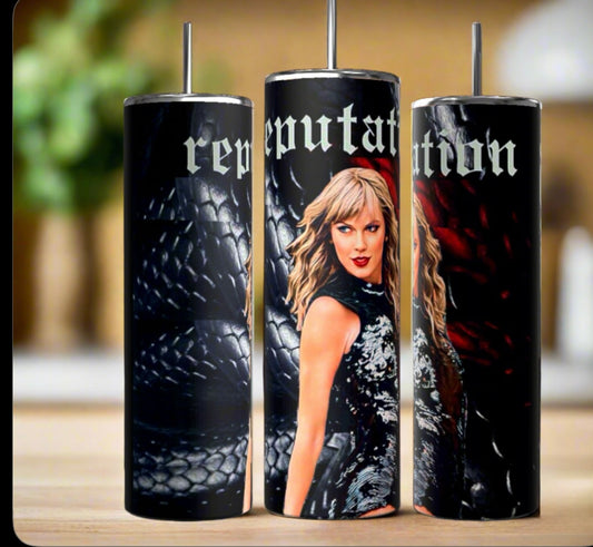 The Kreative Kreationz Taylor Swift Reputation Snake 20oz Tumbler features a woman with blonde hair in black, set on a dark scaly background with "reputation" in gothic letters—a stylish, eco-friendly addition to any collection.