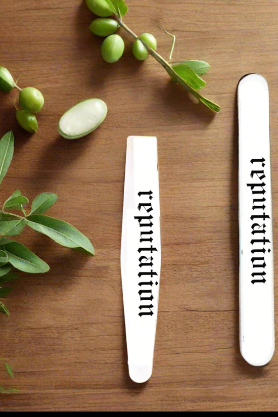 The REPUTATION Stainless Steel Nail File by Kreative Kreationz features 