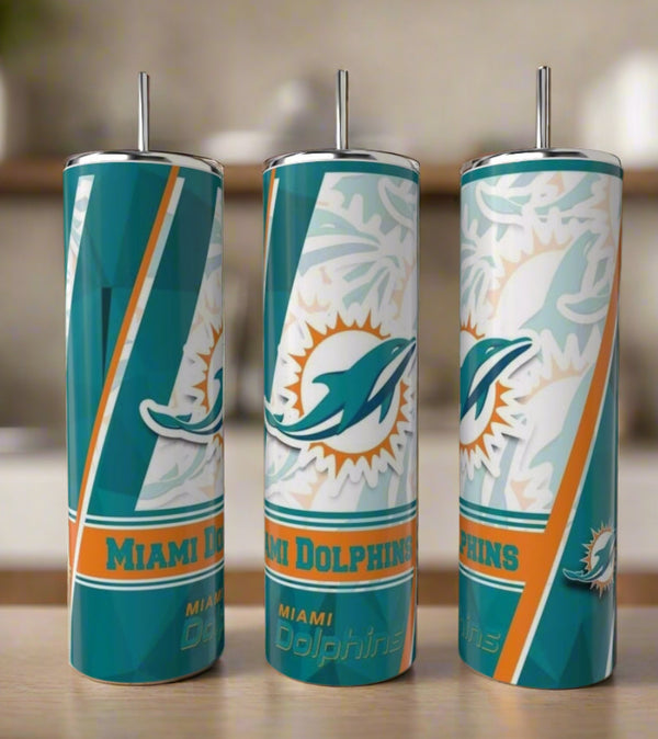 Three Kreative Kreationz Miami Dolphins 20oz Skinny Tumblers, made of durable stainless steel and featuring the team logo in teal, orange, and white, stand together on a kitchen counter—an ideal reusable set for fans.