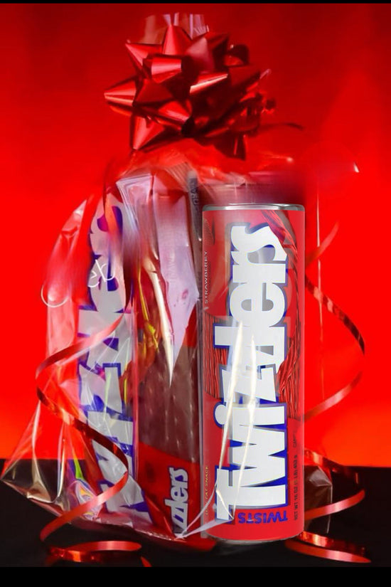 A gift-wrapped Kreative Kreationz Twizzler Tumbler/Candy Gift Set with a red bow and ribbons sits beside a sleek 20oz tumbler. The vivid red background contrasts beautifully with the tumbler's stainless steel finish, creating an eye-catching display.