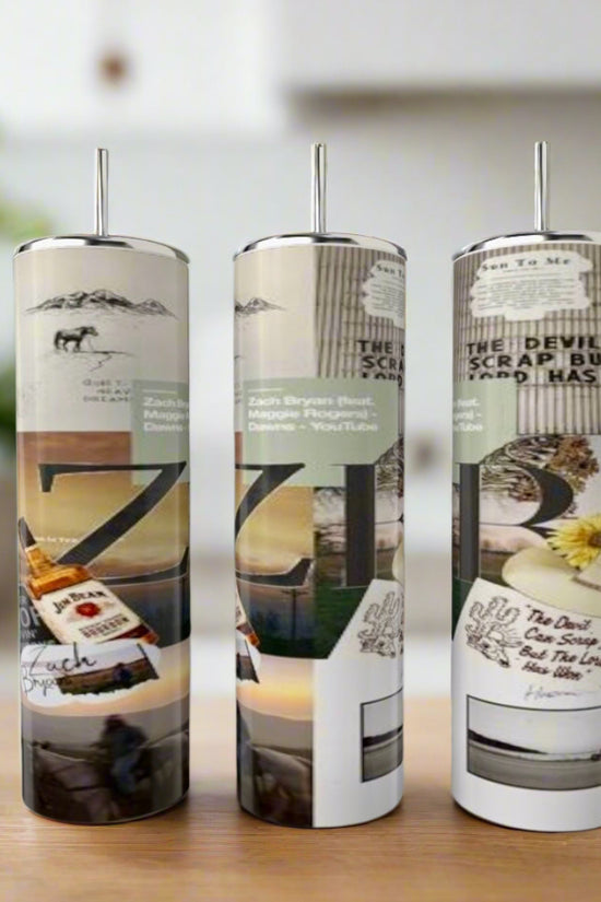 Three Kreative Kreationz Zach Bryan 20oz tumblers with metal straws feature collage-style designs of text, nature, and abstract patterns. These eco-friendly, reusable stainless steel tumblers are displayed against a blurred indoor backdrop.