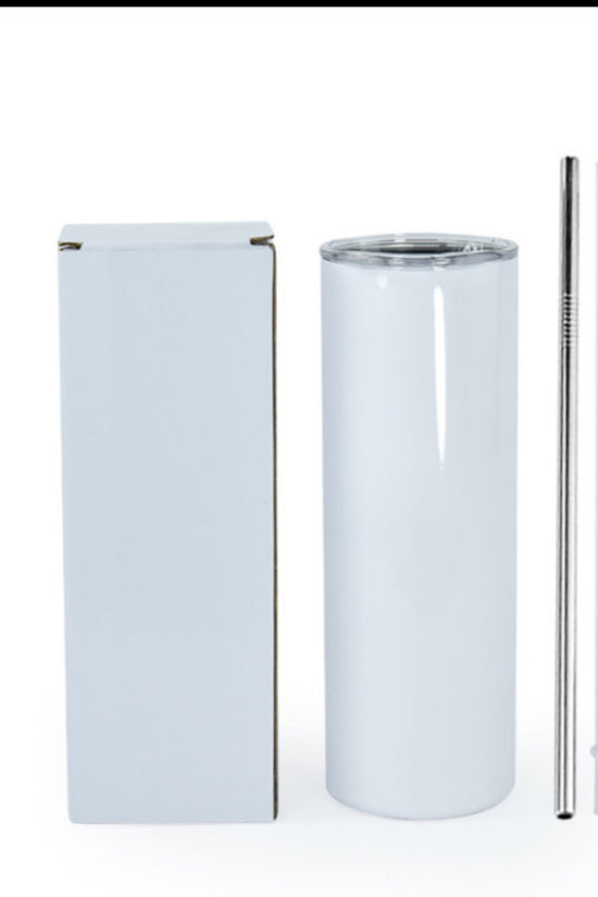 A sleek, white Kreative Kreationz Yellowstone 20oz Tumbler with a transparent lid sits beside a plain box. Next to the stainless steel tumbler are both metal and clear plastic straws, all set against a plain white background.